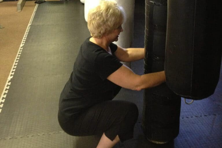 An older woman working on strength